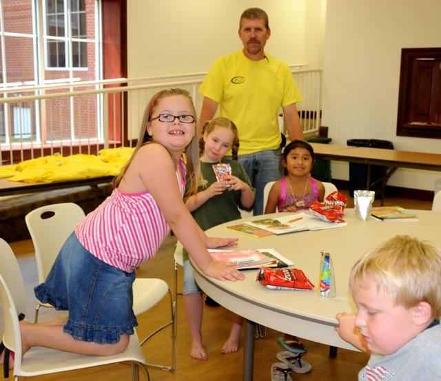 Darran Kennon's Bible Adventures class was a favorite. The group shared adventures with Biblical characters each day with stories, songs, games, projects and activities. He is joined around the table, from left in front of him: Nikki Daminguez, Rhiannon Lovelace, Hannah Wade and Aidan Horner, front left. Kennon is industrial educator at the CU Technology Training Center which hosts Kids College.  (CU Photo by Linda Waggener)